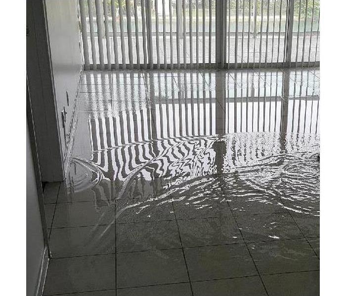 Standing water on the floor due to pipe burst